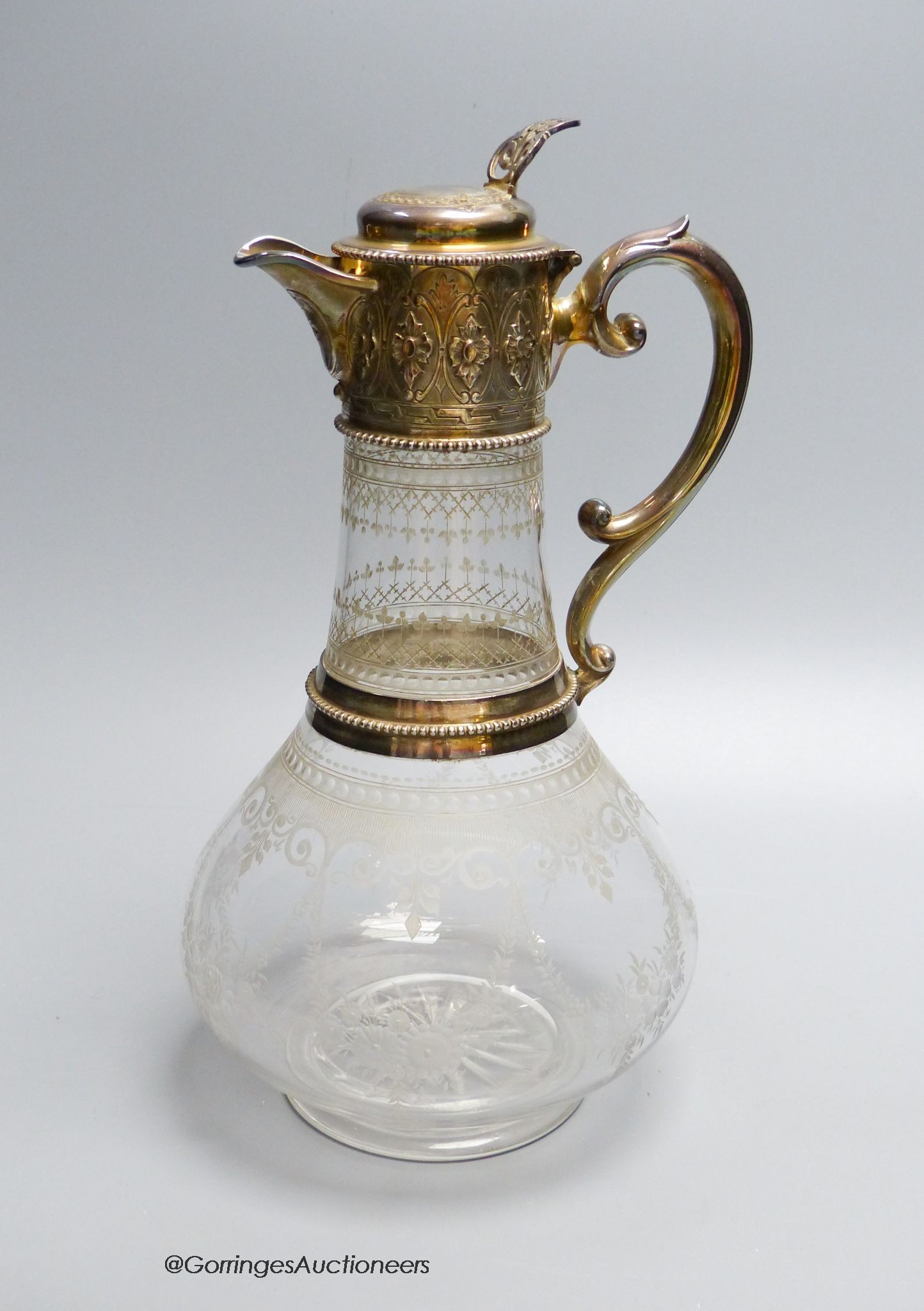 A Victorian silver mounted wheel engraved glass claret jug, by W & G Sissons, Sheffield 1868, 28 cm high